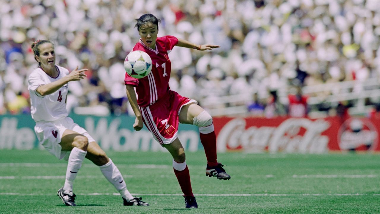 China's Zhang Ouying and Carla Overbeck for America compete during the final match of the FIFA World Cup at the Rose Bowl in Pasadena, California in 1999.