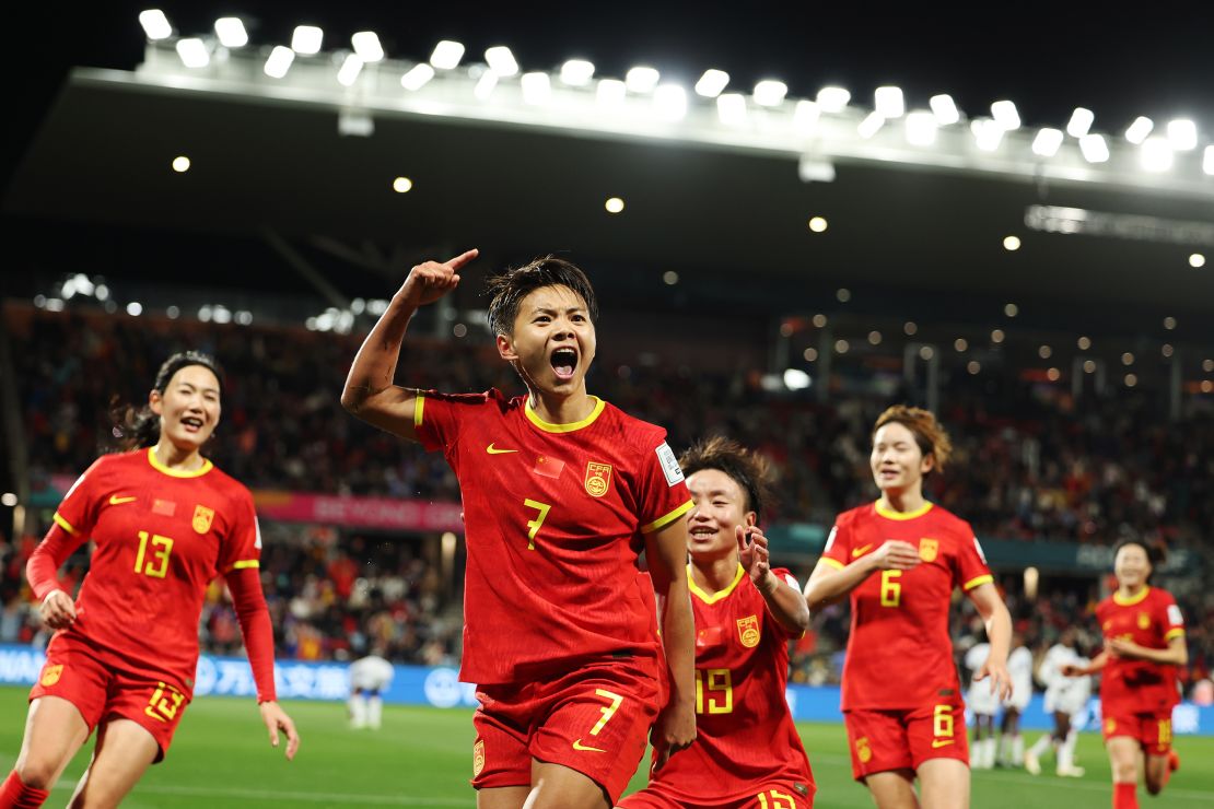 Wang Shuang celebrates with teammates after scoring for China against Haiti. 