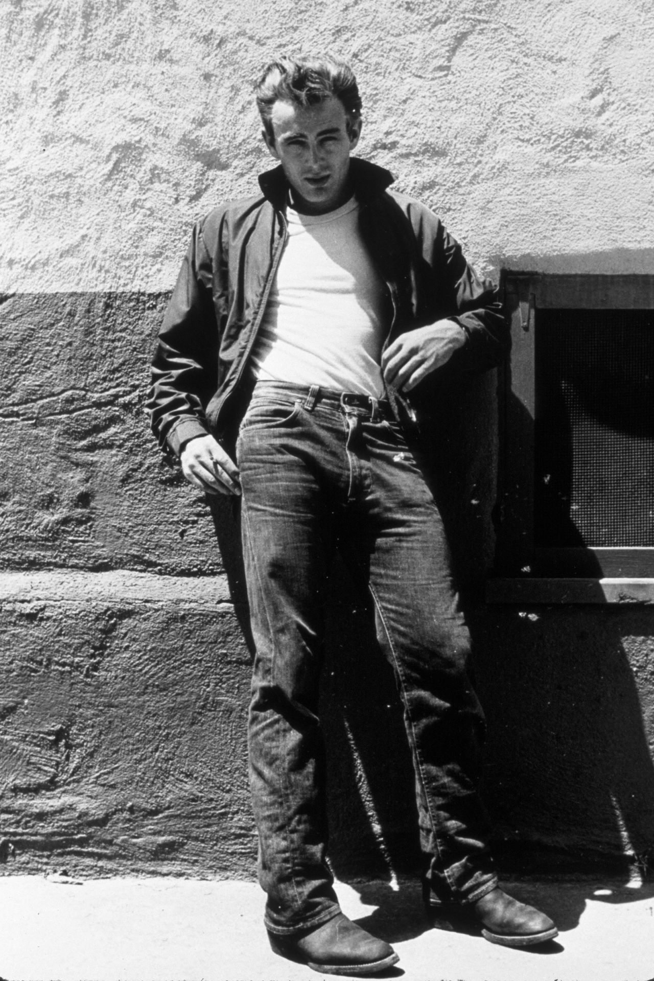 Editorial use only
James Dean is pictured on the set of the 1955 movie "Rebel Without a Cause," wearing a classic white T-Shirt, Levi's jeans and a leather jacket. Dean embodied a style aspirational to many '50s teens.