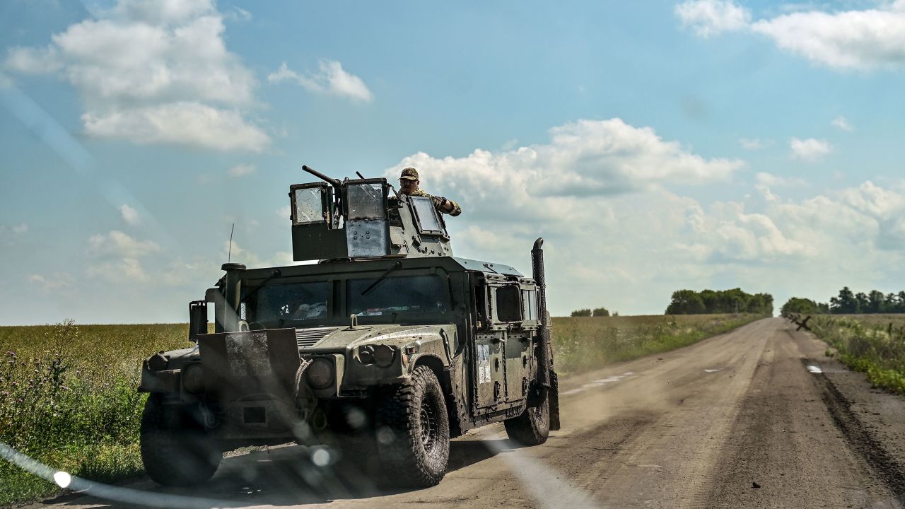 A vehicle of the Ukrainian Armed Forces moves along the road in Novodarivka village, Zaporizhzhia Region.