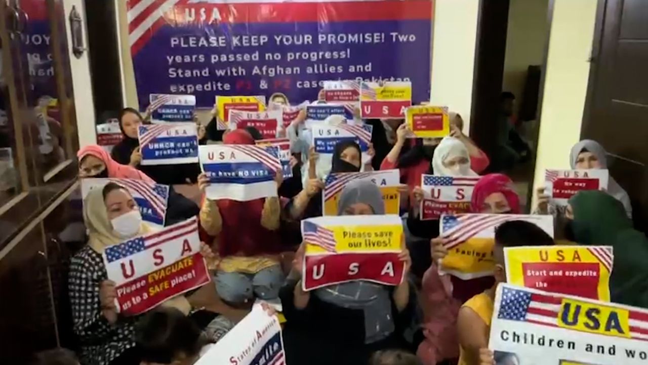 screengrab afghan women holding sign