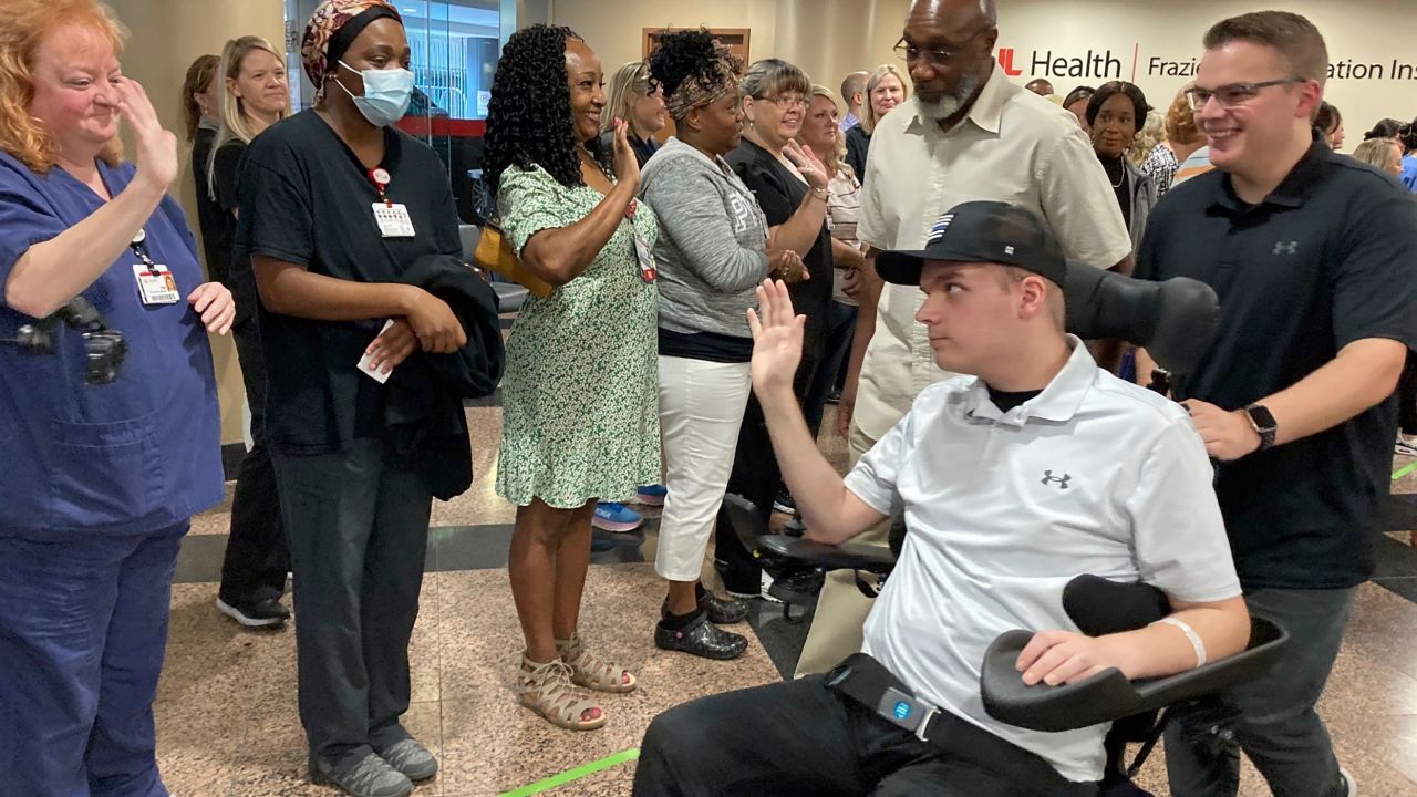 Louisville police officer Nickolas Wilt leaves a medical rehabilitation center in Louisville, Kentucky, on Friday, July 28, 2023.