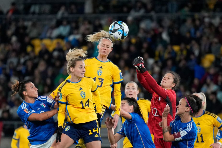 Sweden's Amanda Ilestedt, center, heads the ball to score the opening goal against Italy on July 29. Sweden won 5-0 to clinch a spot in the round of 16.