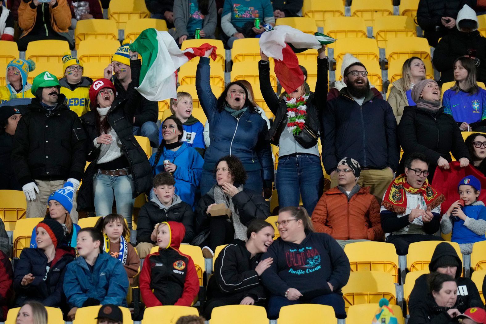 Italy fans cheer before their team's match against Sweden in Wellington, New Zealand.