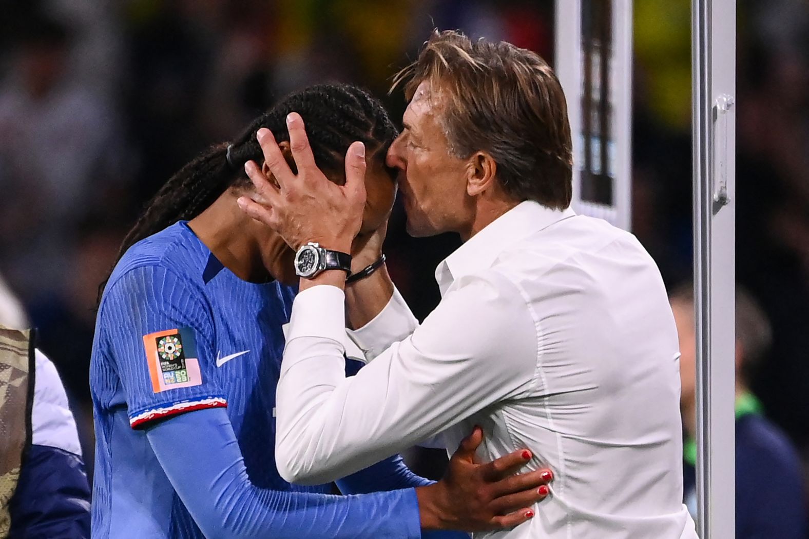 French coach Herve Renard kisses defender Wendie Renard on the forehead after her winning goal secured a <a href="index.php?page=&url=https%3A%2F%2Fwww.cnn.com%2F2023%2F07%2F28%2Ffootball%2Ffrance-brazil-jamaica-panama-sweden-italy-womens-world-cup-spt-intl%2Findex.html" target="_blank">2-1 win against Brazil</a> on July 29.