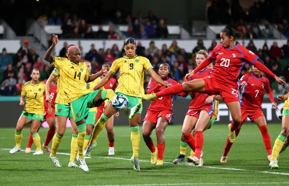 Panama's Aldrith Quintero, right, reaches for the ball in front of Jamaica's Deneisha Blackwood and Kameron Simmonds on Saturday, July 29. <a href=