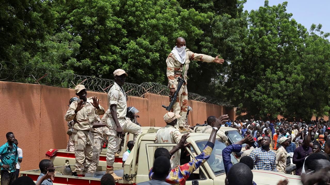 Security forces prepare to disperse pro-junta demonstrators gathered outside the French embassy, in Niamey on July 30, 2023. 