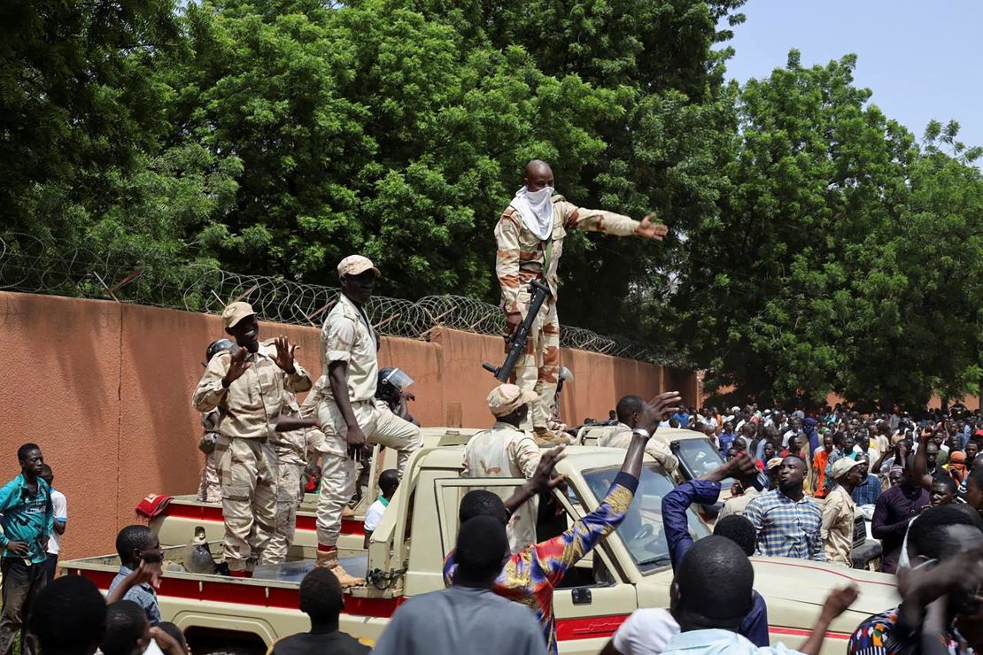 Security forces prepare to disperse pro-junta demonstrators gathered outside the French embassy, in Niamey on July 30, 2023. 