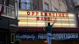 PHOENIXVILLE, PENNSYLVANIA - JULY 16: An employee adds letters for upcoming film releases "Oppenheimer" and "Barbie" to a marquee at the Colonial Theater on July 16, 2023 in Phoenixville, Pennsylvania. The Christopher Nolan directed biopic on theoretical physicist Robert Oppenheimer and the Greta Gerwig directed live-action film on doll Barbie are both set to be released in theaters nationwide this Friday.  (Photo by Mark Makela/Getty Images)