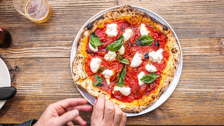 <strong>Neapolitan pizza:</strong> Neapolitan pizza has UNESCO status, and there's an association in Italy that promotes and protects the simple, delicious dish. Click through the gallery for more photos of beloved pizza types: