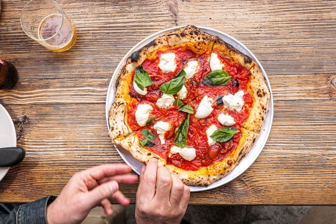 <strong>Neapolitan pizza:</strong> Neapolitan pizza has UNESCO status, and there's an association in Italy that promotes and protects the simple, delicious dish. Click through the gallery for more photos of beloved pizza types: