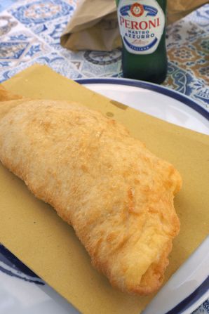 <strong>Pizza fritta: </strong>In Naples, fried pizza, or <em>pizza fritta,</em> is sometimes sealed and fried in the shape of a calzone.