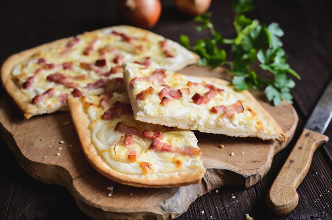 <strong>Tarte flambée: </strong>France makes plenty of traditional pizza, but its tarte flambée is a relative, often topped with crème fraiche, cheese, onion and bacon.