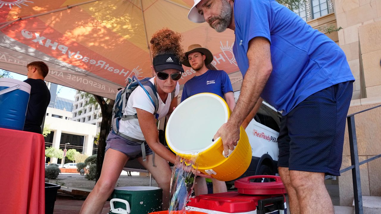 The City of Phoenix Heat Response Program team volunteers prepare heat relief kits for the public in need.