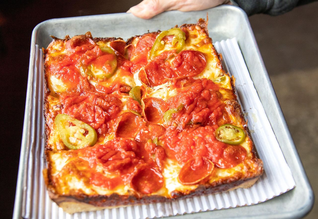 2J4DJ31 Detroit style pizza at Michigan & Trumbull, Detroit, MI, USA
