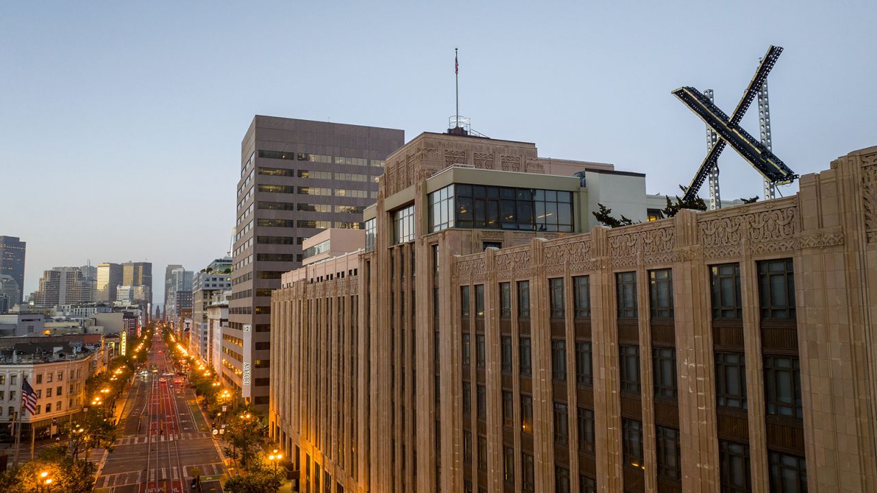 An aerial view shows a newly constructed X sign on the roof of the headquarters of the social media platform previously known as Twitter, in San Francisco, on July 29, 2023. 