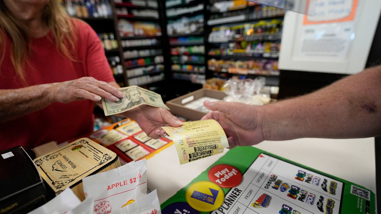 A cashier sells tickets for the Mega Millions lottery in Harahan, Louisiana, on Wednesday.