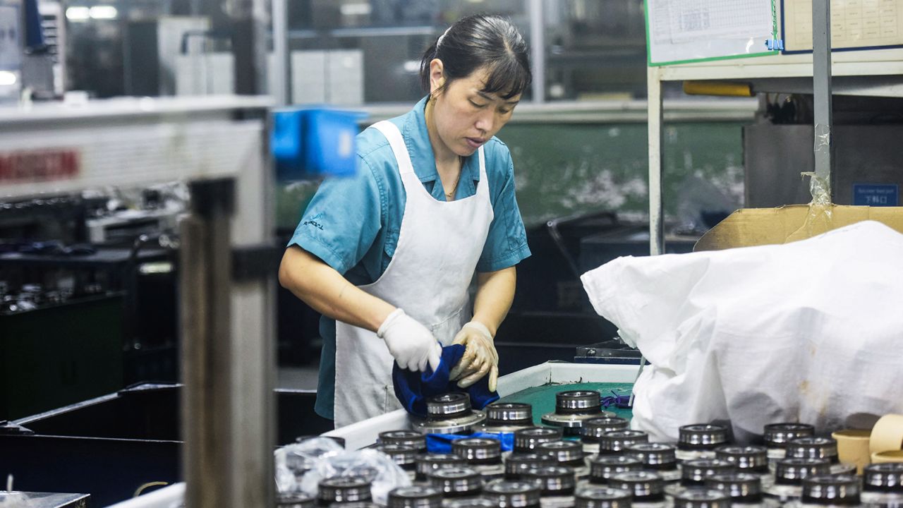 A worker produces automotive bearings at a factory in Hangzhou, in China's eastern Zhejiang province on July 31, 2023. 