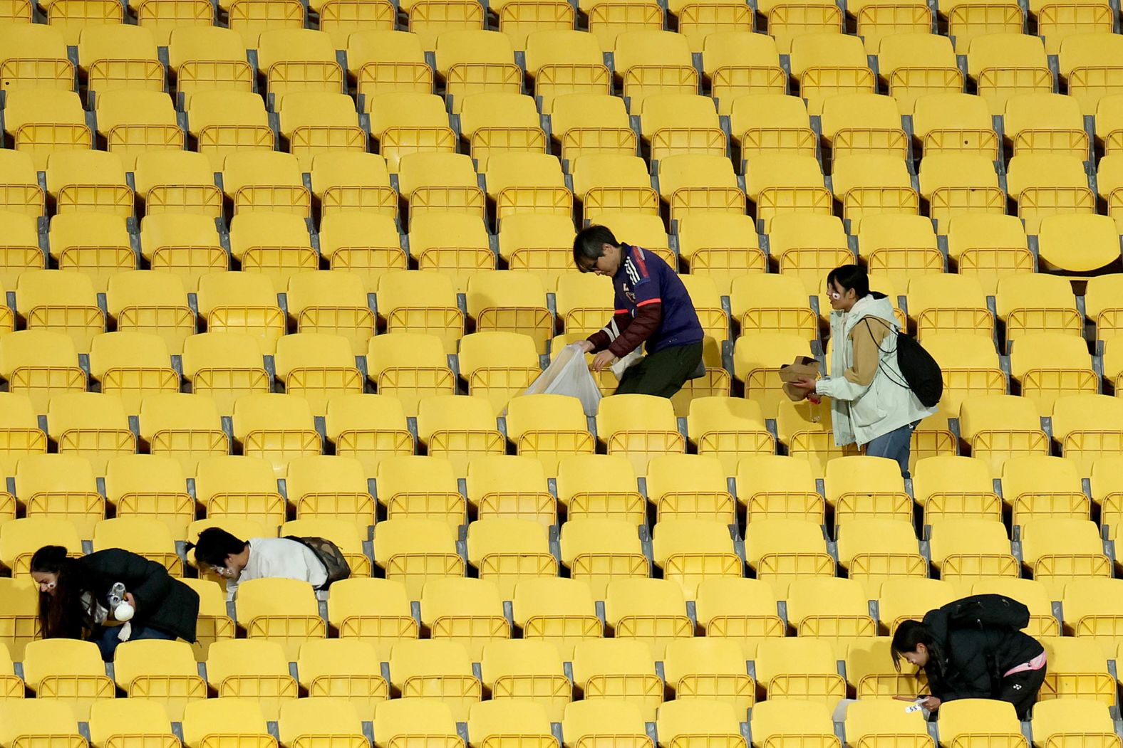 Fans of Japan help clean after the match in Wellington, New Zealand. Japan's fans have become known in recent years for their efforts to <a href="index.php?page=&url=https%3A%2F%2Fwww.cnn.com%2F2023%2F07%2F22%2Ffootball%2Fjapan-fans-tidying-womens-world-cup-2023-spt-intl%2Findex.html" target="_blank">clean stands after matches</a>.