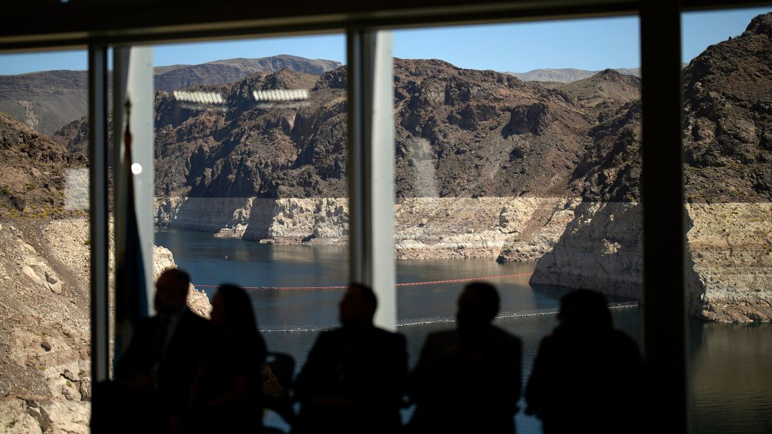Officials listen during a news conference at the Hoover Dam on Lake mead on April 11.