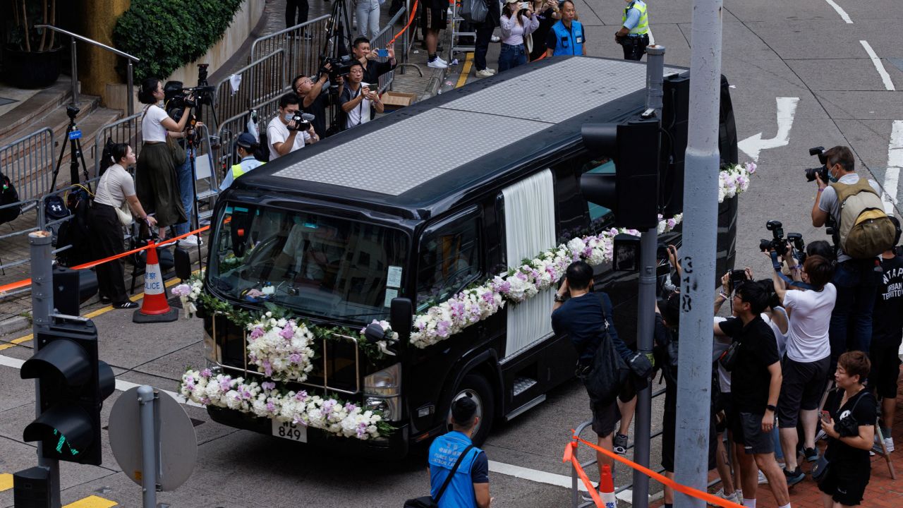 The hearse carrying the casket of singer and songwriter CoCo Lee departs from a funeral home in Hong Kong.