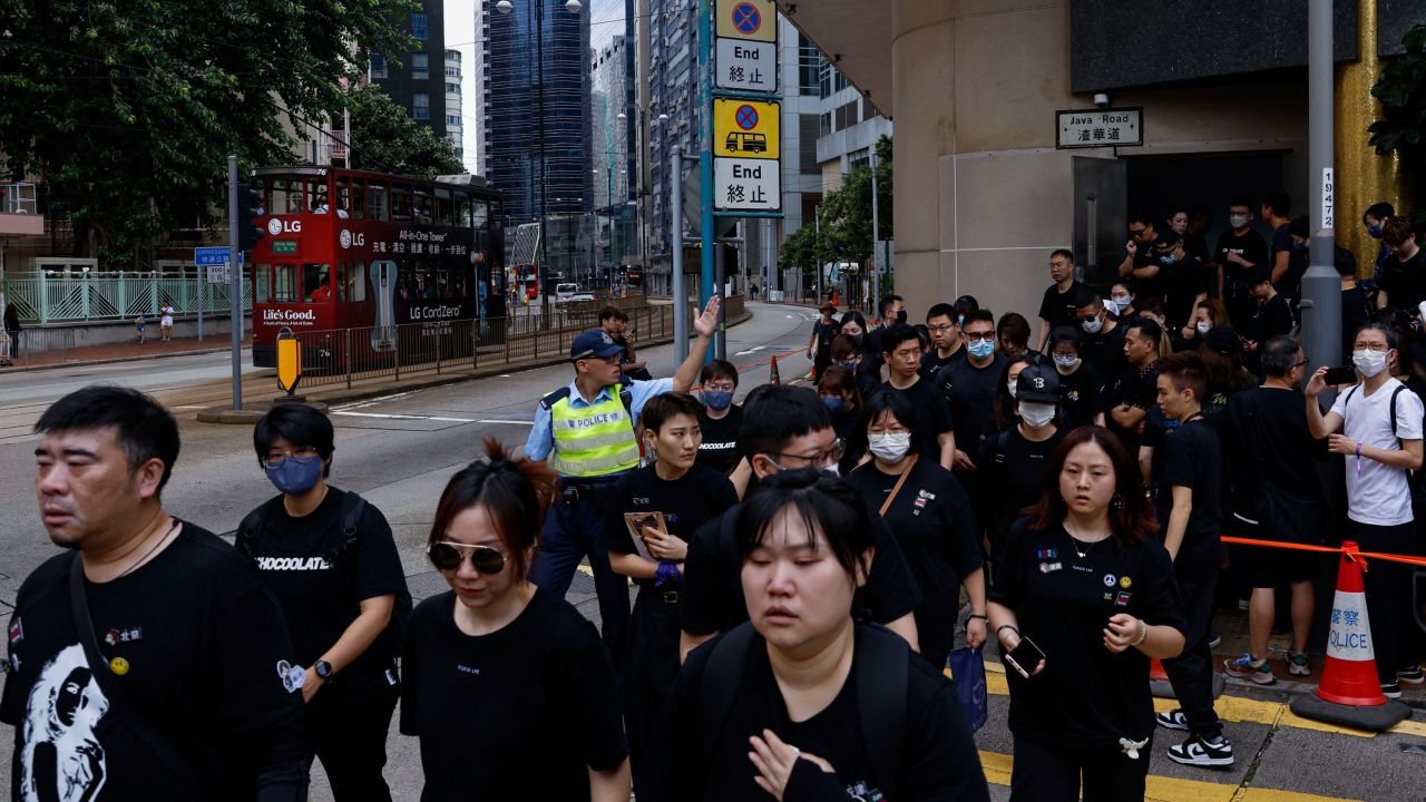 Fans leave the funeral of singer and songwriter CoCo Lee, in Hong Kong.