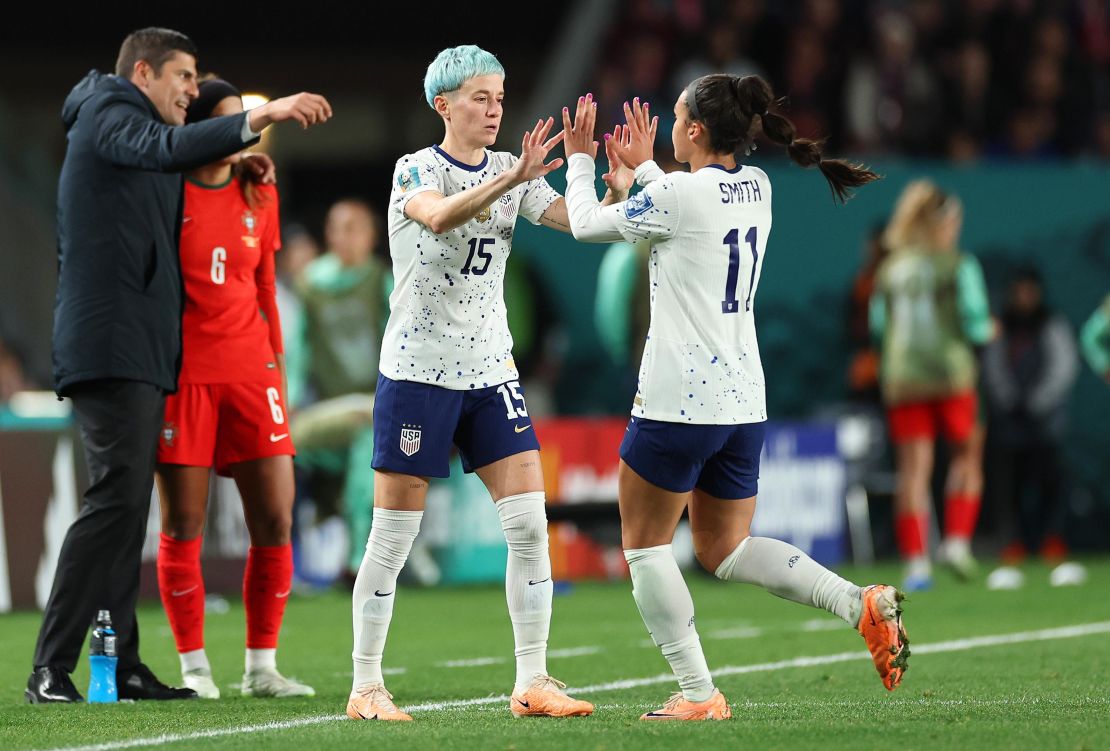 Sophia Smith (R) comes off to be replaced by  Rapinoe (L) during the match against Portugal.