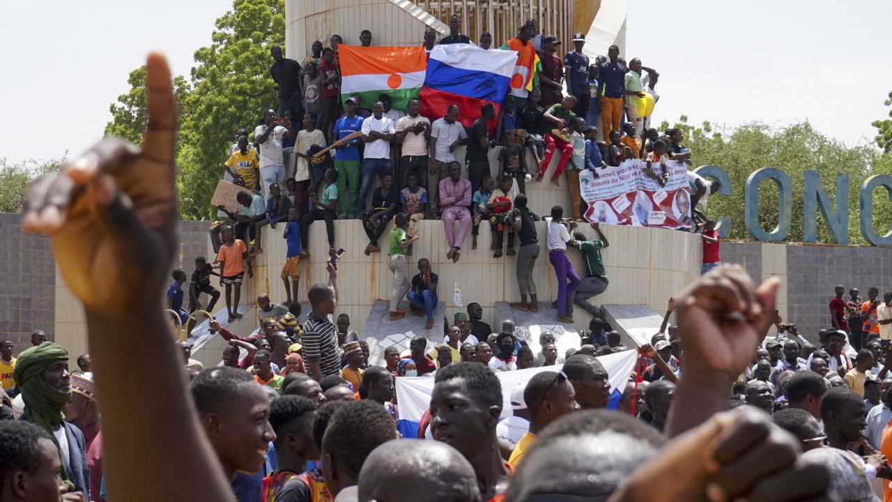 Anti-colonial and pro-Russia supporters stand outside the National Assembly building in Niamey on Sunday.