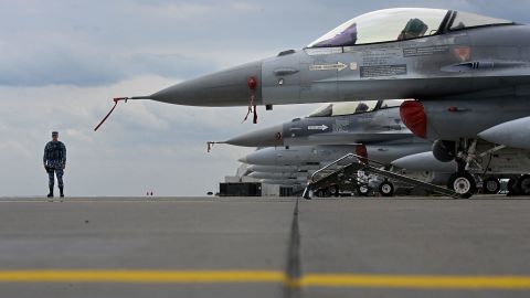 Portugese Air Force and Romanian Air Force F-16 jetfighters sit on the tarmac of Siauliai airbase in Lithuania during the NATO exercise as part of the NATO Air Policing mission, on July 4, 2023. (Photo by John THYS / AFP) (Photo by JOHN THYS/AFP via Getty Images)