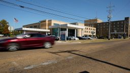 Traffic passes the publicly owned Greenwood Leflore Hospital, in Greenwood, Miss., Friday, Oct. 21, 2022. The hospital announced the permanent closure of its labor and delivery unit, saying it can't pay competitive wages to nurses. The closure means the area's women will need to travel about 45 minutes to give birth at a hospital, and without focused hospital support, the city's only OB/GYN clinic could struggle to provide maternity care. (AP Photo/Rogelio V. Solis)