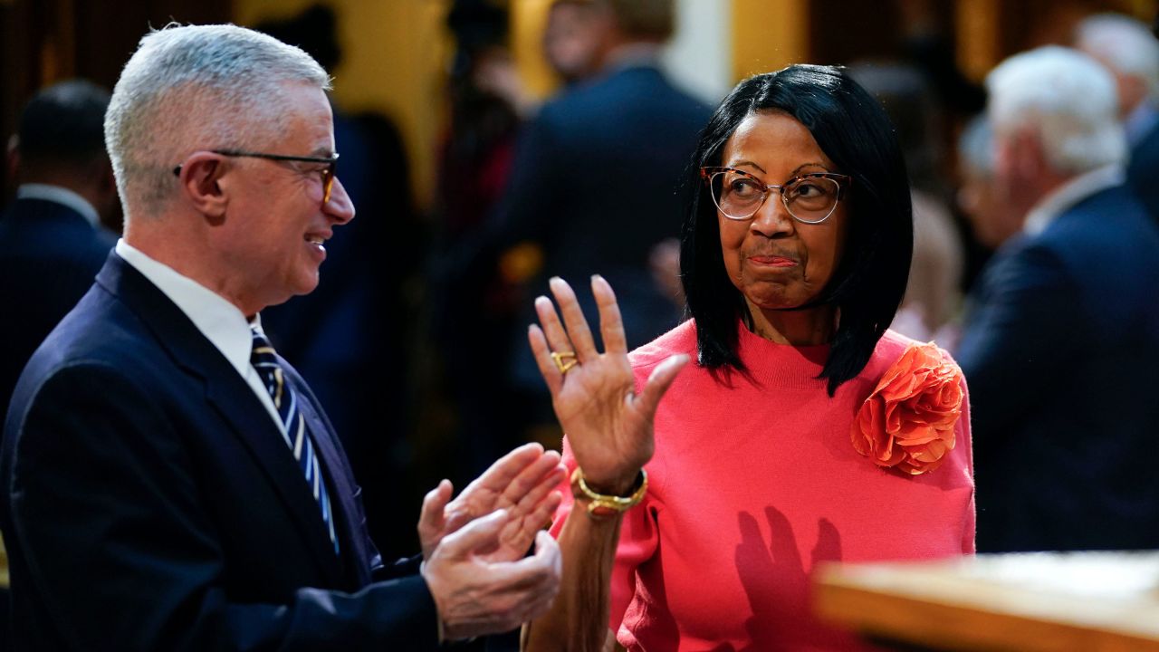 Lt. Gov. Sheila Oliver waves as former governor Jim McGreevey applauds before Gov. Phil Murphy delivers the budget address at the New Jersey Statehouse on Tuesday, Feb. 28, 2023.