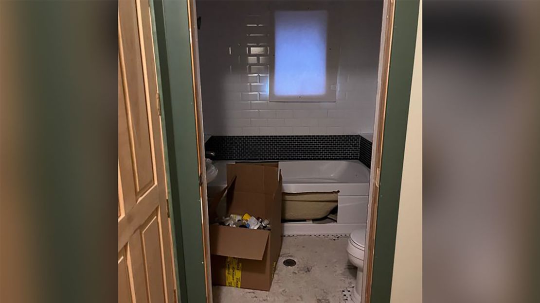 A bathtub in the house was cut open during the search.