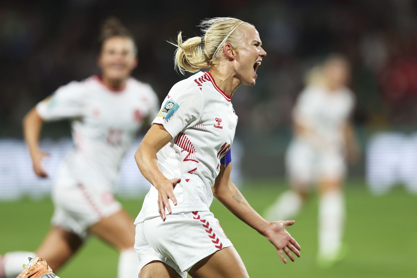 Pernille Harder celebrates after scoring the first goal of Denmark's 2-0 victory over Haiti on August 1. <a href="index.php?page=&url=https%3A%2F%2Fwww.cnn.com%2Fsport%2Flive-news%2Fuswnt-portugal-group-stage-womens-world-cup-08-01-23%2Fh_d2ec41756a8f7e49b2ca2590e3226d01" target="_blank">The win</a>, coupled with China's defeat against England, meant Denmark would advance to the knockout stage and face co-host Australia.