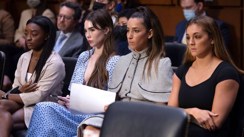 FILE - United States gymnasts from left, Simone Biles, McKayla Maroney, Aly Raisman and Maggie Nichols, arrive to testify during a Senate Judiciary hearing about the Inspector General's report on the FBI's handling of the Larry Nassar investigation on Capitol Hill, Sept. 15, 2021, in Washington. The FBI has reached out to attorneys representing Olympic gold medalist Simone Biles and other women who say they were sexually assaulted by Larry Nassar to begin settlement talks in the $1 billion claim they brought against the federal government, according to three people familiar with the matter. (Saul Loeb/Pool via AP, File)