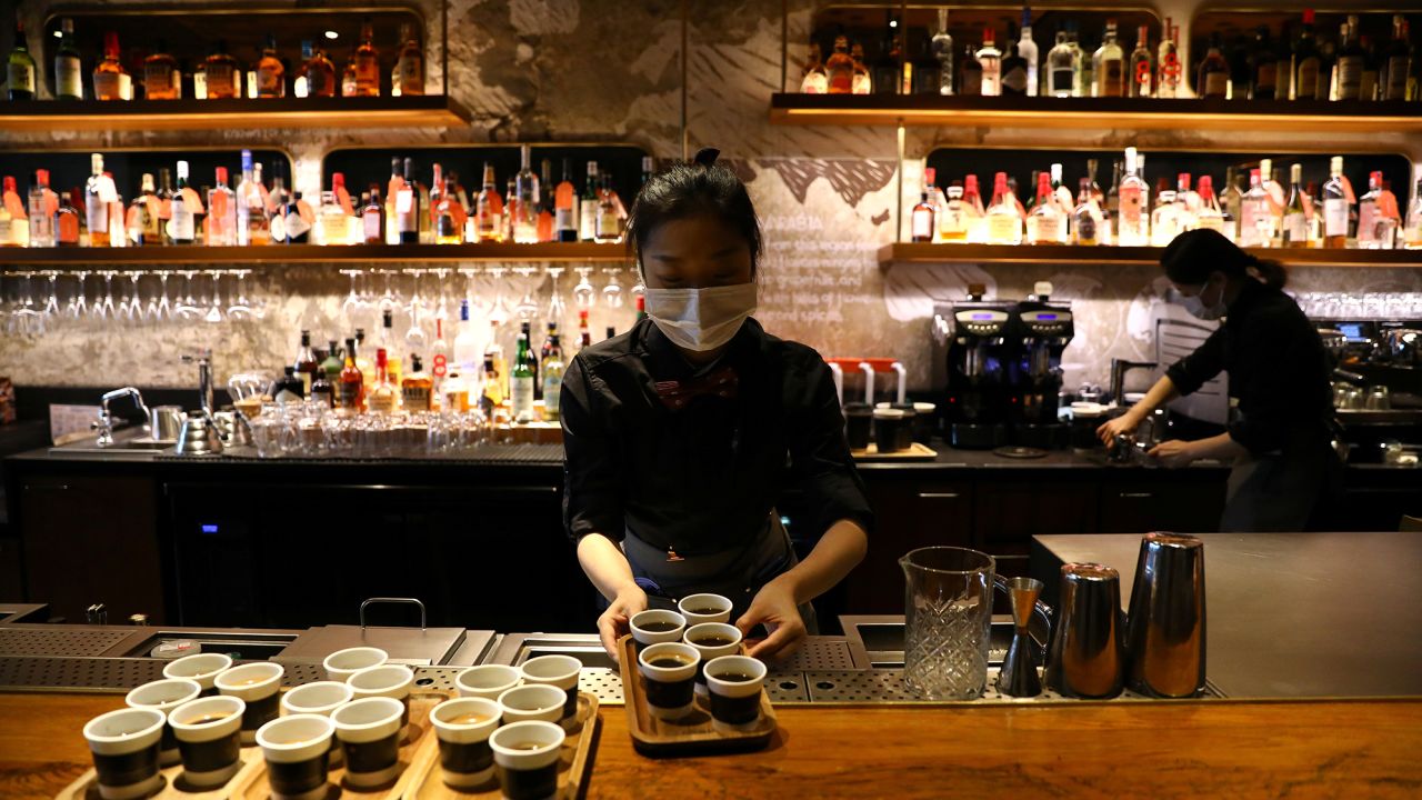 A barista serves coffee at a Starbucks flagship store in Beijing, China January 18, 2022. 