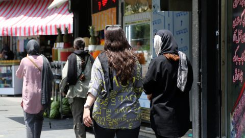 Women walk on the streets of Tehran as the country's morality police resume hijab patrols in Iran on July 18.