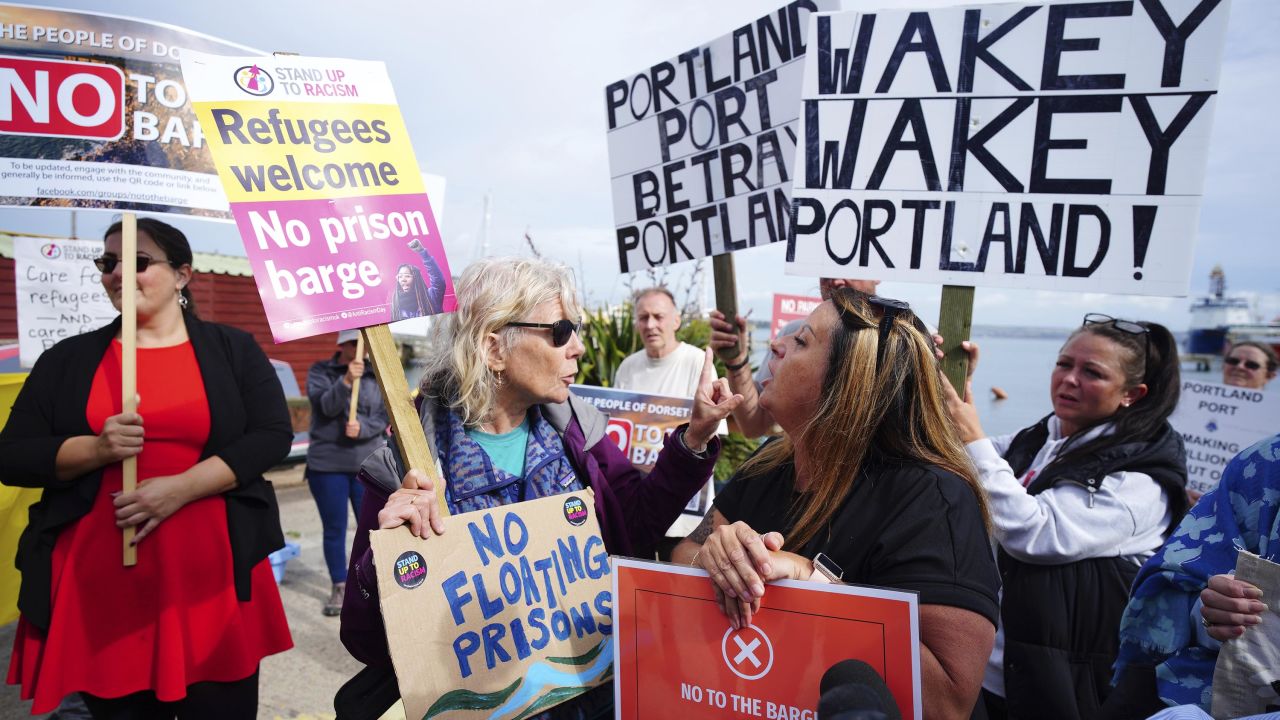 Rival protesters argue in Portland, Dorset, where the Bibby Stockholm docked on July 18, 2023.