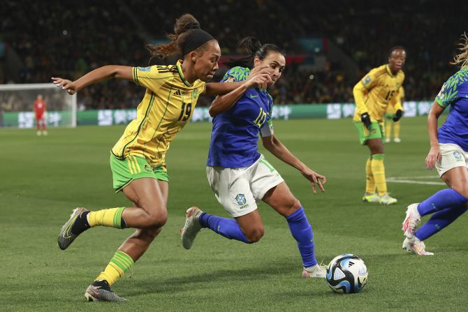 Brazil's Marta, right, competes against Jamaica's Tiernny Wiltshire on August 2. <a href="https://www.cnn.com/2023/08/01/football/brazil-jamaica-france-panama-womens-world-cup-spt-intl/index.html" target="_blank">The two teams drew 0-0</a>, but it was Jamaica that advanced to the knockout stage of the tournament. This was the last World Cup for Marta, the tournament's record scorer and veteran of six tournaments.