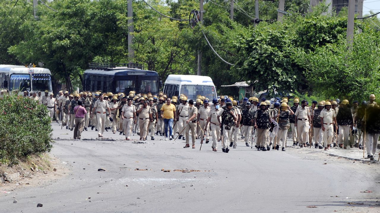 Extra police personnel are deployed in Nuh, India, on August 1, 2023. 
