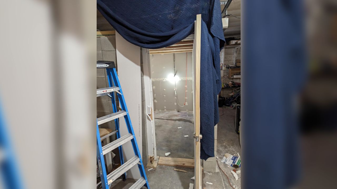 A woman escaped from this makeshift cinder block cell, the FBI says.