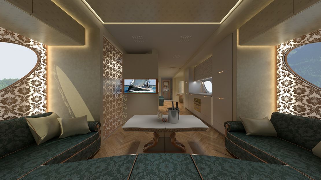 The living room area has a wrap-around sofa, 42-inch LED screen TV and adjacent bar cabinet and wine fridge.
