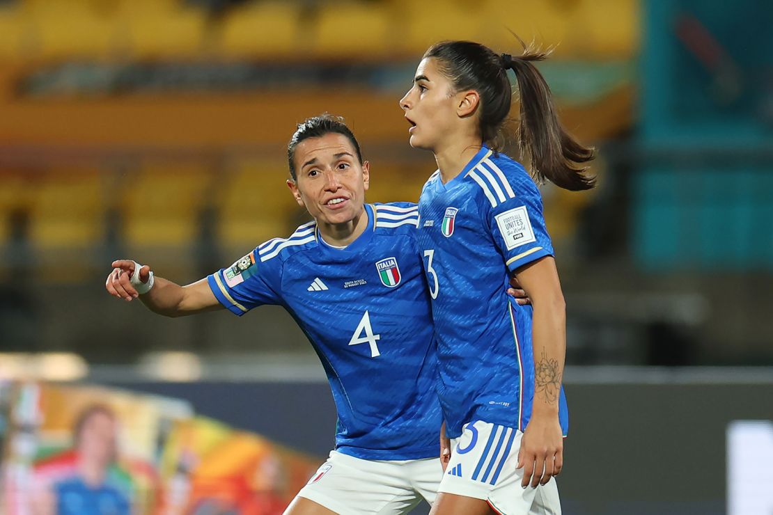 Benedetta Orsi is consoled by her teammate Lucia Di Guglielmo after scoring an own goal against South Africa.