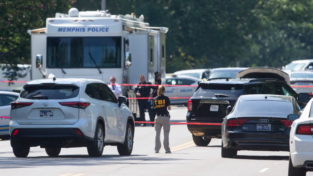 A Tennessee Bureau of Investigation agent and Memphis Police Department officers respond in Memphis on Monday. A man who had been firing his gun at Margolin Hebrew Academy was located in the area by patrolling MPD officers. 