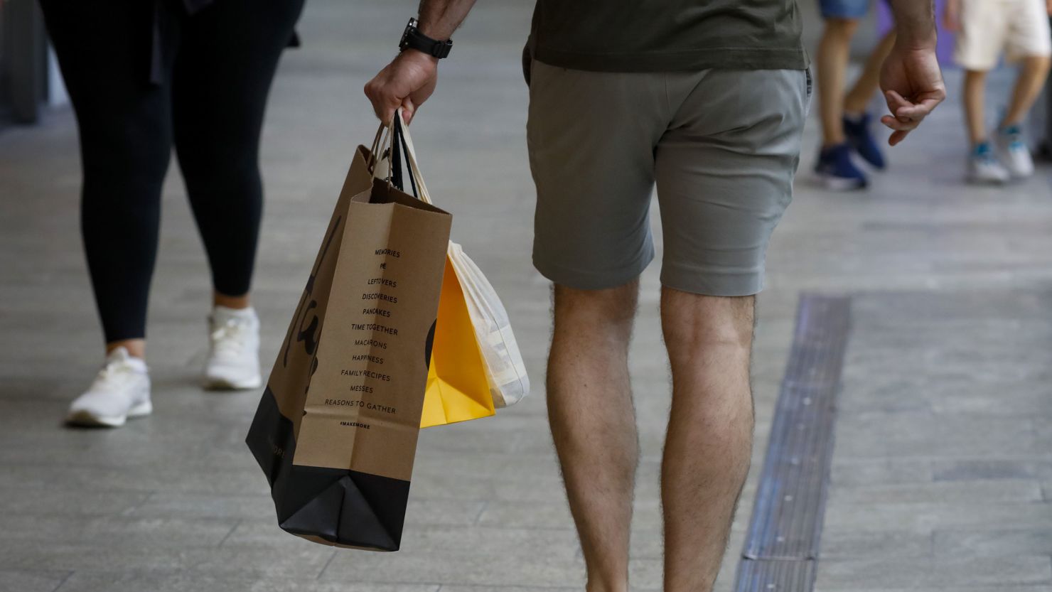 A shopper carries retail bags in Miami on Wednesday, June 14, 2023. 