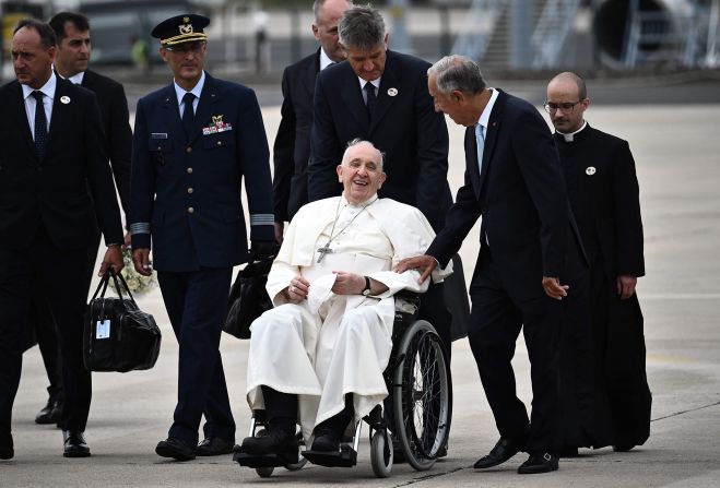 Pope Francis is welcomed by Portuguese President Marcelo Rebelo de Sousa after landing in Lisbon, Portugal, to attend a World Youth Day gathering in August 2023.