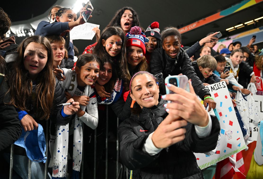 US forward Alex Morgan  takes a selfie with fans at Eden Park on August 1, 2023.