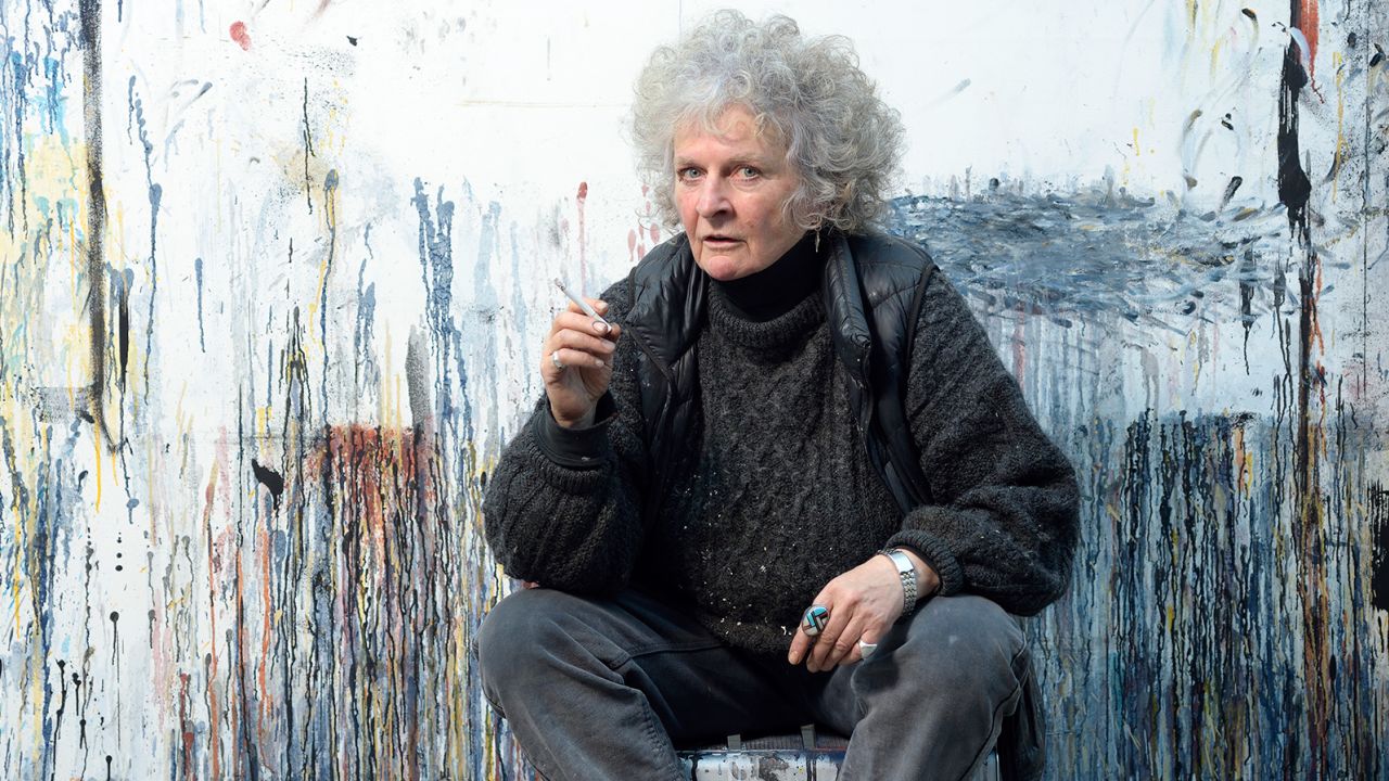 Maggi Hambling is known for her trademark "look" - a nest of bouffant grey hair, eyelashes clumpy with mascara and a padded black gilet.