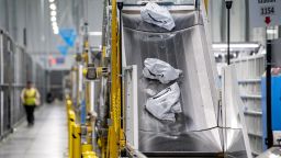 Packages on a conveyer belt at an Amazon fulfillment center on Prime Day in Melville, New York, US, on Tuesday, July 11, 2023. 