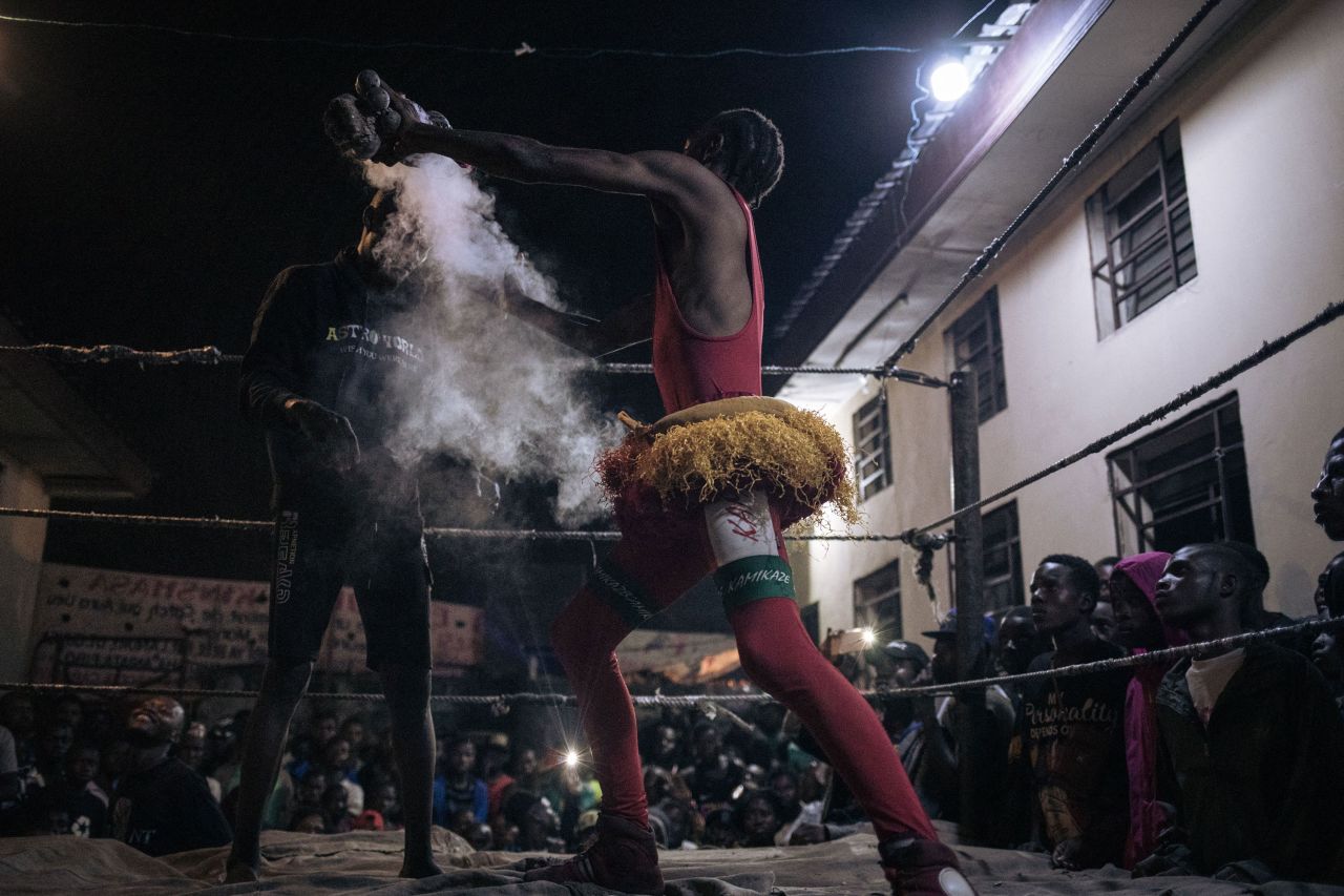 Voodoo wrestlers fight in a schoolyard in Kinshasa, Democratic Republic of the Congo, on Saturday, July 29. 