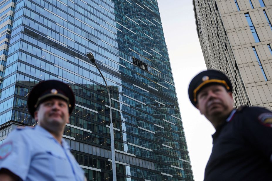 Emergency personnel work near an office building damaged by a Ukrainian drone attack in Moscow on Tuesday, August 1. Russia says Ukraine <a href=